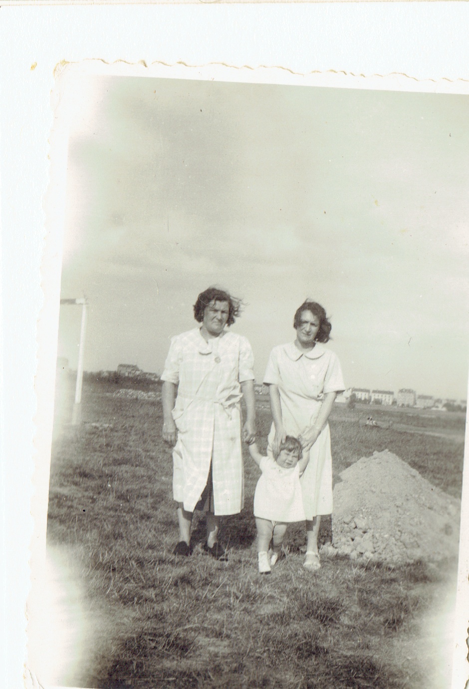 Hanna with two caregivers in a field